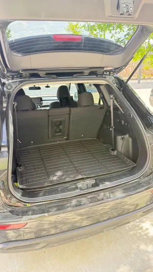 Open cargo area in the back of the Mitsubishi Outlander for passenger luggage